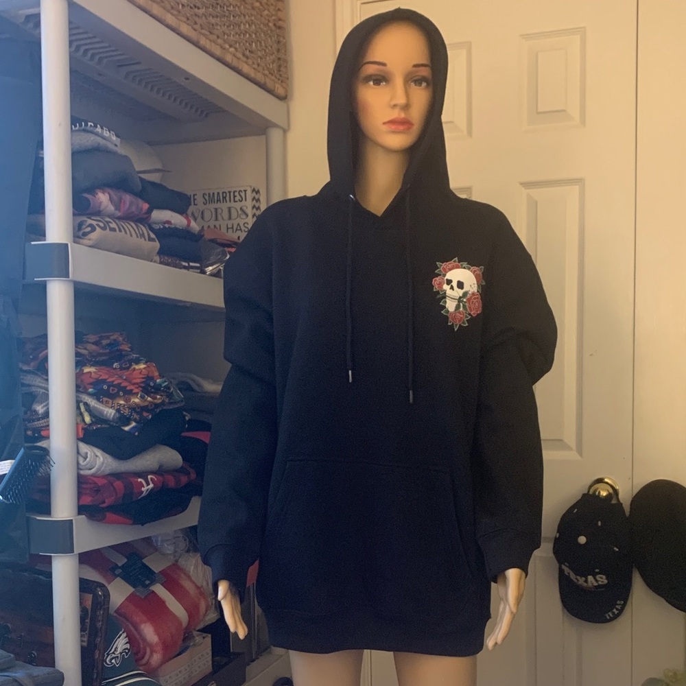 Brand new with tags LA Black Hoodie with Skull and Rose Design. Size L